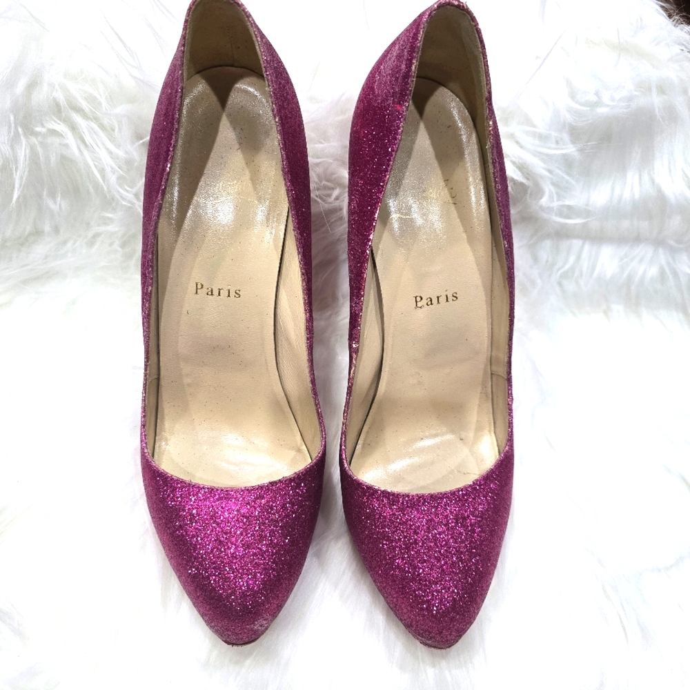 Pink Christian Louboutin glitter pumps.